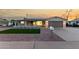 Charming single-story home featuring a quaint porch and a well-maintained front yard at 434 N 56Th St, Mesa, AZ 85205