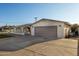 Charming single-story home featuring a low maintenance yard and a wide driveway leading to a two-car garage at 434 N 56Th St, Mesa, AZ 85205
