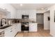 Modern kitchen features white cabinets, stainless steel appliances, and light countertops at 434 N 56Th St, Mesa, AZ 85205