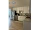 Modern kitchen with stainless steel appliances, white cabinetry, and stylish backsplash at 434 N 56Th St, Mesa, AZ 85205
