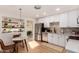 Bright kitchen with stainless steel appliances and eat-in table next to open shelving at 434 N 56Th St, Mesa, AZ 85205