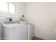Practical laundry room with standard washer and dryer units against a white brick wall at 434 N 56Th St, Mesa, AZ 85205