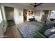 Bright living area featuring neutral paint, green couch, ceiling fan, and a cozy atmosphere at 434 N 56Th St, Mesa, AZ 85205