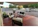 Cozy covered patio with outdoor seating, overlooking a landscaped backyard, perfect for relaxing at 434 N 56Th St, Mesa, AZ 85205