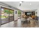 Bright dining area with access to the backyard patio through sliding glass doors at 438 E Larkspur Ln, Tempe, AZ 85288