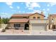 Charming stucco home features a red tile roof, two-car garage, and well-maintained landscaping at 438 E Larkspur Ln, Tempe, AZ 85288