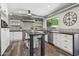 Modern kitchen with stainless steel appliances, white cabinetry, and a stylish island at 438 E Larkspur Ln, Tempe, AZ 85288