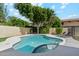 Private backyard pool and patio with lounge chairs and mature landscaping at 438 E Larkspur Ln, Tempe, AZ 85288