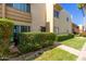 Condo exterior with green landscaping, walkway, private front door, and a private patio space at 4600 N 68Th St # 379, Scottsdale, AZ 85251