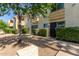 Apartment exterior with manicured bushes and shade tree, offering a pleasing curb appeal at 4600 N 68Th St # 379, Scottsdale, AZ 85251