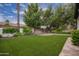 Private backyard oasis with beautiful desert landscaping and privacy wall at 4711 E Buckboard Ct, Gilbert, AZ 85297