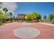 Community basketball court next to residential area, with trees and landscaping at 4711 E Buckboard Ct, Gilbert, AZ 85297
