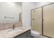Bathroom boasts granite counters, modern vanity, and a tiled shower with glass doors at 4711 E Buckboard Ct, Gilbert, AZ 85297