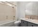 Bathroom featuring a white tub/shower combination and a vanity with gray cabinets at 4711 E Buckboard Ct, Gilbert, AZ 85297