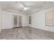Bright bedroom with tray ceiling, tiled floors, neutral color, and french doors at 4711 E Buckboard Ct, Gilbert, AZ 85297