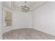 Cozy bedroom featuring a stylish light fixture and a window with natural light at 4711 E Buckboard Ct, Gilbert, AZ 85297