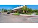 Exterior view of community clubhouse with ample parking and well-maintained landscaping at 4711 E Buckboard Ct, Gilbert, AZ 85297