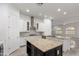 Modern kitchen boasts stainless steel appliances, granite counters, and a spacious center island at 4711 E Buckboard Ct, Gilbert, AZ 85297