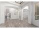Elegant living room with archways, tiled floors, and ample natural light at 4711 E Buckboard Ct, Gilbert, AZ 85297