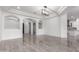 Expansive room with tile floors, arched doorways and architectural details offers versatile living space at 4711 E Buckboard Ct, Gilbert, AZ 85297