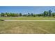 Expansive community park with open grass area and mature trees at 4711 E Buckboard Ct, Gilbert, AZ 85297