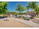 A park and playground in a well-maintained community with benches and a covered area at 4711 E Buckboard Ct, Gilbert, AZ 85297