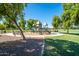 Playground featuring modern play structures, seating, and walking paths at 4711 E Buckboard Ct, Gilbert, AZ 85297
