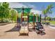 Community playground with multiple slides, stairs, and canopy for shade at 4711 E Buckboard Ct, Gilbert, AZ 85297