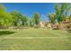 Community volleyball court with well-maintained grass and surrounding greenery for outdoor fun at 4711 E Buckboard Ct, Gilbert, AZ 85297