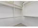 Bright walk-in closet featuring white shelving and metal rods for maximum storage at 4711 E Buckboard Ct, Gilbert, AZ 85297