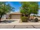 Inviting single-Gathering home featuring a two-car garage, desert landscaping, and a neutral color scheme at 5320 E Silverbell Rd, San Tan Valley, AZ 85143