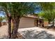 Charming home with a two-car garage and xeriscaped front yard for low-maintenance appeal at 5320 E Silverbell Rd, San Tan Valley, AZ 85143