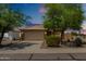 Inviting single-Gathering home featuring a two-car garage, desert landscaping, and a neutral color scheme at 5320 E Silverbell Rd, San Tan Valley, AZ 85143