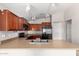 Open kitchen with stainless sink, countertops, and cabinetry, complete with modern appliances at 5320 E Silverbell Rd, San Tan Valley, AZ 85143