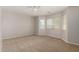 Spacious bedroom with carpet, neutral walls and multiple windows for lots of natural light at 5320 E Silverbell Rd, San Tan Valley, AZ 85143