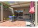Relaxing covered patio with dining and lounge furniture for entertaining, and a beautiful view of the landscape at 541 N Lesueur St, Mesa, AZ 85203