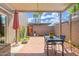 A fully covered back patio with brick flooring and patio furniture at 541 N Lesueur St, Mesa, AZ 85203