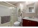 Clean bathroom with glass enclosed shower, modern vanity, and tasteful decor at 541 N Lesueur St, Mesa, AZ 85203