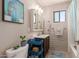 Well-lit bathroom features neutral walls, vanity with sink, mirror, and toilet with storage at 541 N Lesueur St, Mesa, AZ 85203