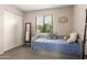 Bright bedroom featuring a daybed, neutral carpet, and a window offering natural light at 541 N Lesueur St, Mesa, AZ 85203