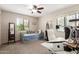 Bright bedroom offers ample natural light, study area, and a daybed for guests at 541 N Lesueur St, Mesa, AZ 85203