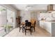 Kitchen and dining area featuring tile flooring, a ceiling fan, and sliding glass door at 541 N Lesueur St, Mesa, AZ 85203
