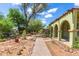 Stroll the peaceful greenbelt with mature trees and lush landscaping throughout community at 541 N Lesueur St, Mesa, AZ 85203