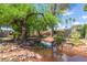 Enjoy serene greenbelt views complete with mature shade trees, lush greenery, and trickling stream at 541 N Lesueur St, Mesa, AZ 85203