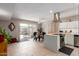 Open concept kitchen with stainless steel appliances and seamless view to the dining area and backyard at 541 N Lesueur St, Mesa, AZ 85203