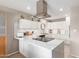 Well-lit kitchen with white cabinets, quartz countertop, and stainless steel appliances at 541 N Lesueur St, Mesa, AZ 85203