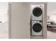 Efficient laundry area with stacked washer and dryer, with bonus living area in view at 541 N Lesueur St, Mesa, AZ 85203