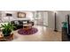 Stylish living room with a decorative mirror, tiled floor, and neutral wall colors at 541 N Lesueur St, Mesa, AZ 85203