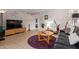 Cozy living room featuring modern decor, tile flooring, and comfortable seating at 541 N Lesueur St, Mesa, AZ 85203