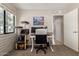 Bright office space featuring a large desk, natural light, and a cozy cat tree at 541 N Lesueur St, Mesa, AZ 85203